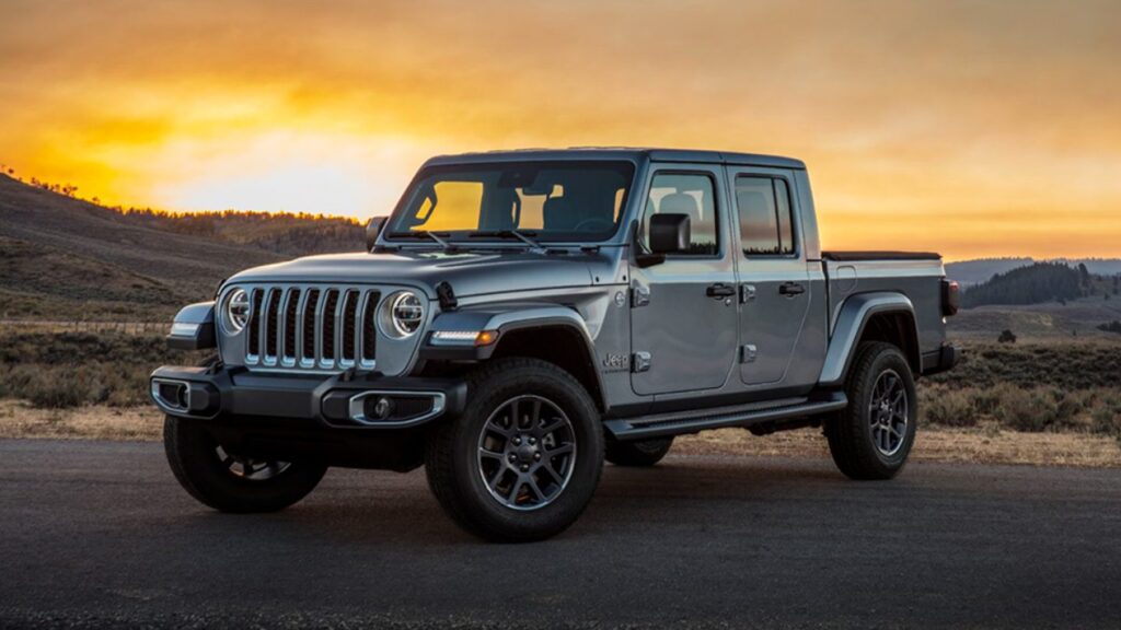 Jeep Wrangler on road with landscape for camping in background