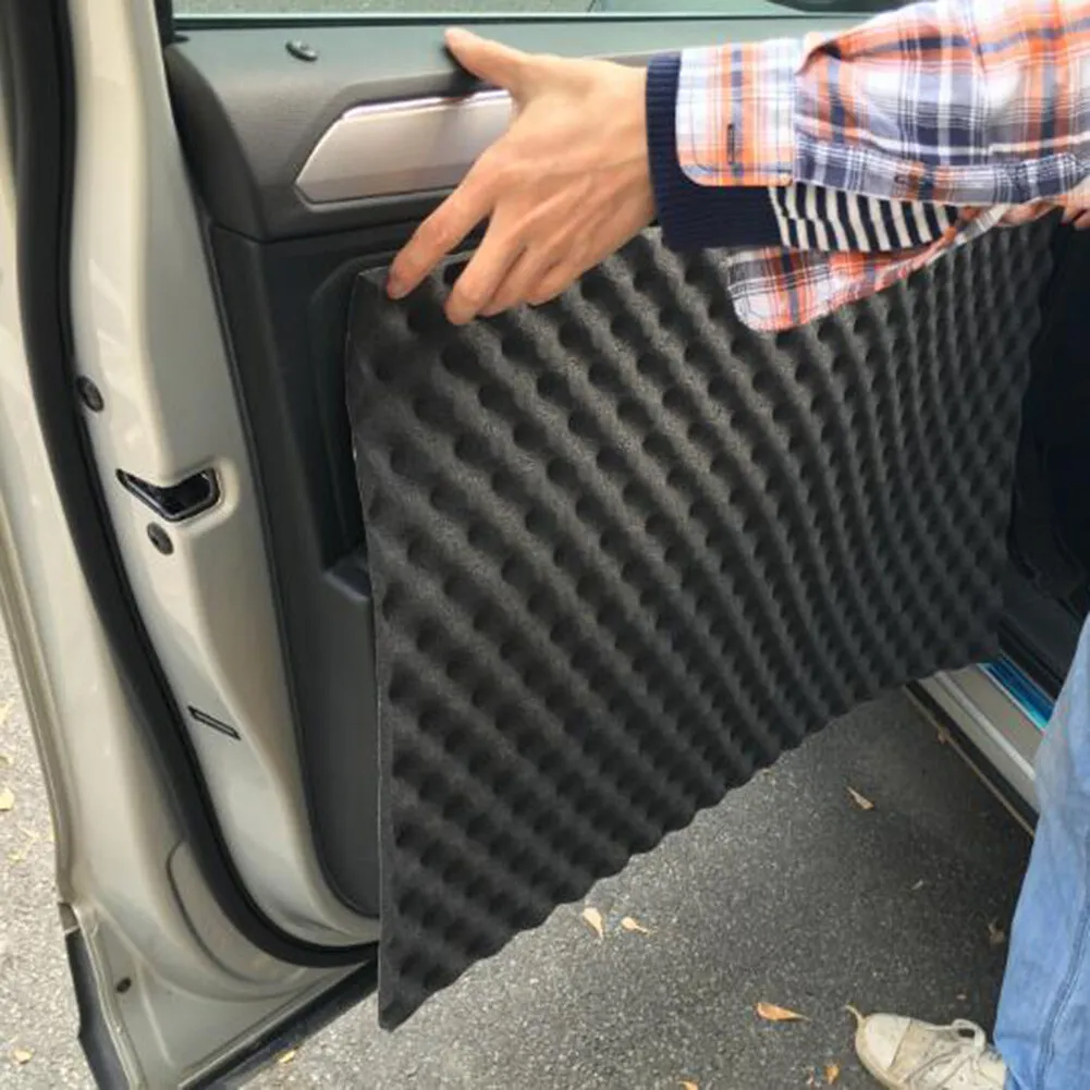 A photo showing sound deadening foam placed in car doors to enhance speaker performance.